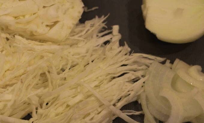 Shred the cabbage and the onion