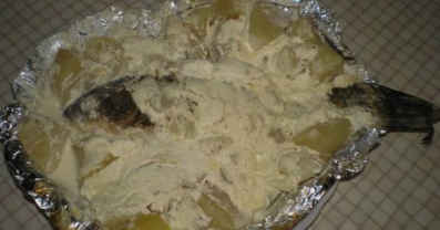 Baked Crucian Carp with Potatoes in Sour Cream